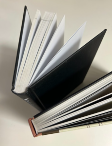 Casebound books example of rounded and square spines